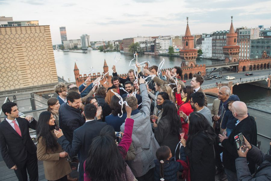 Celebrations at the end of Kate and Vish's Berlin wall wedding