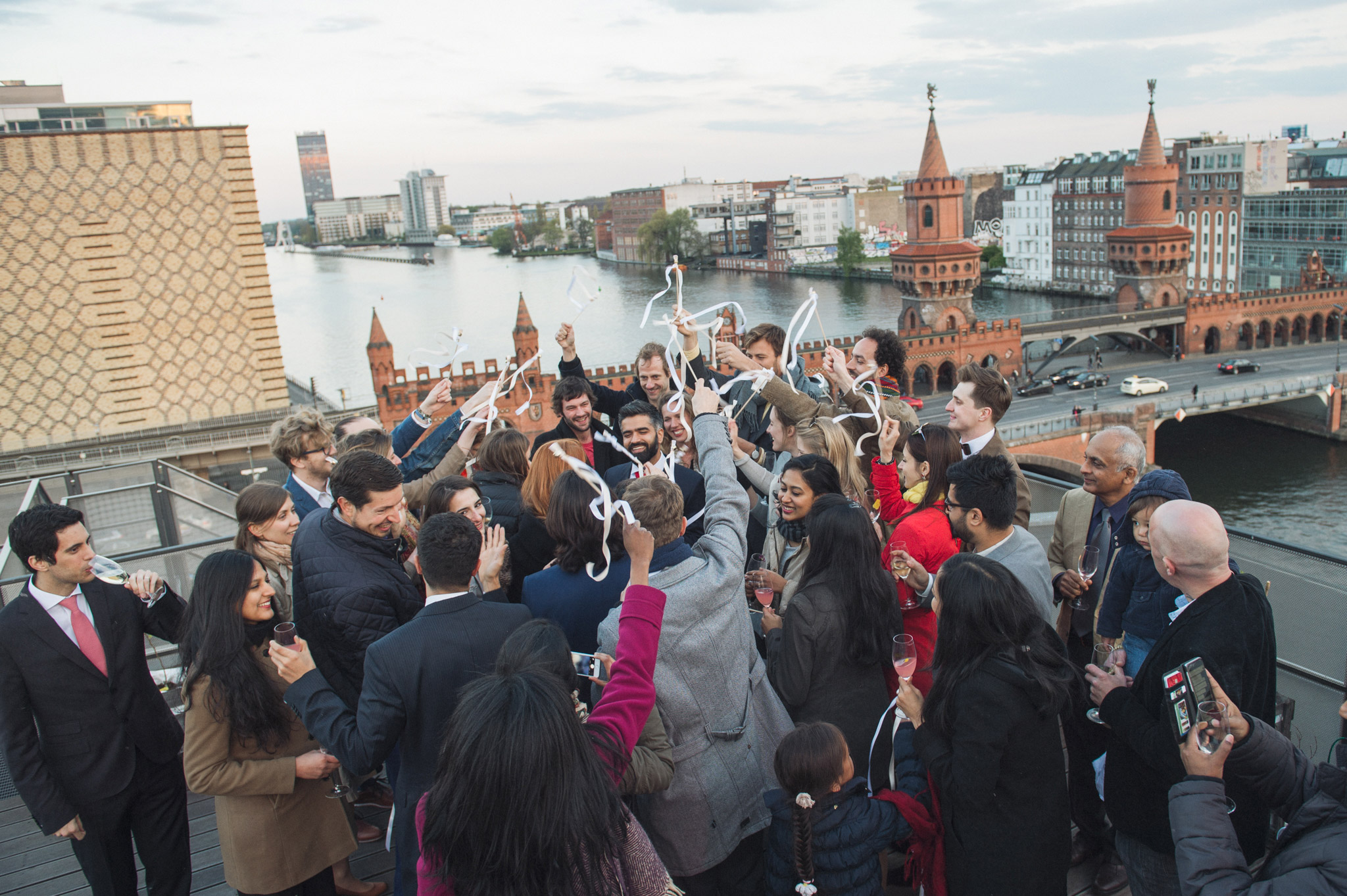 Celebrations at the end of Kate and Vish's Berlin wall wedding