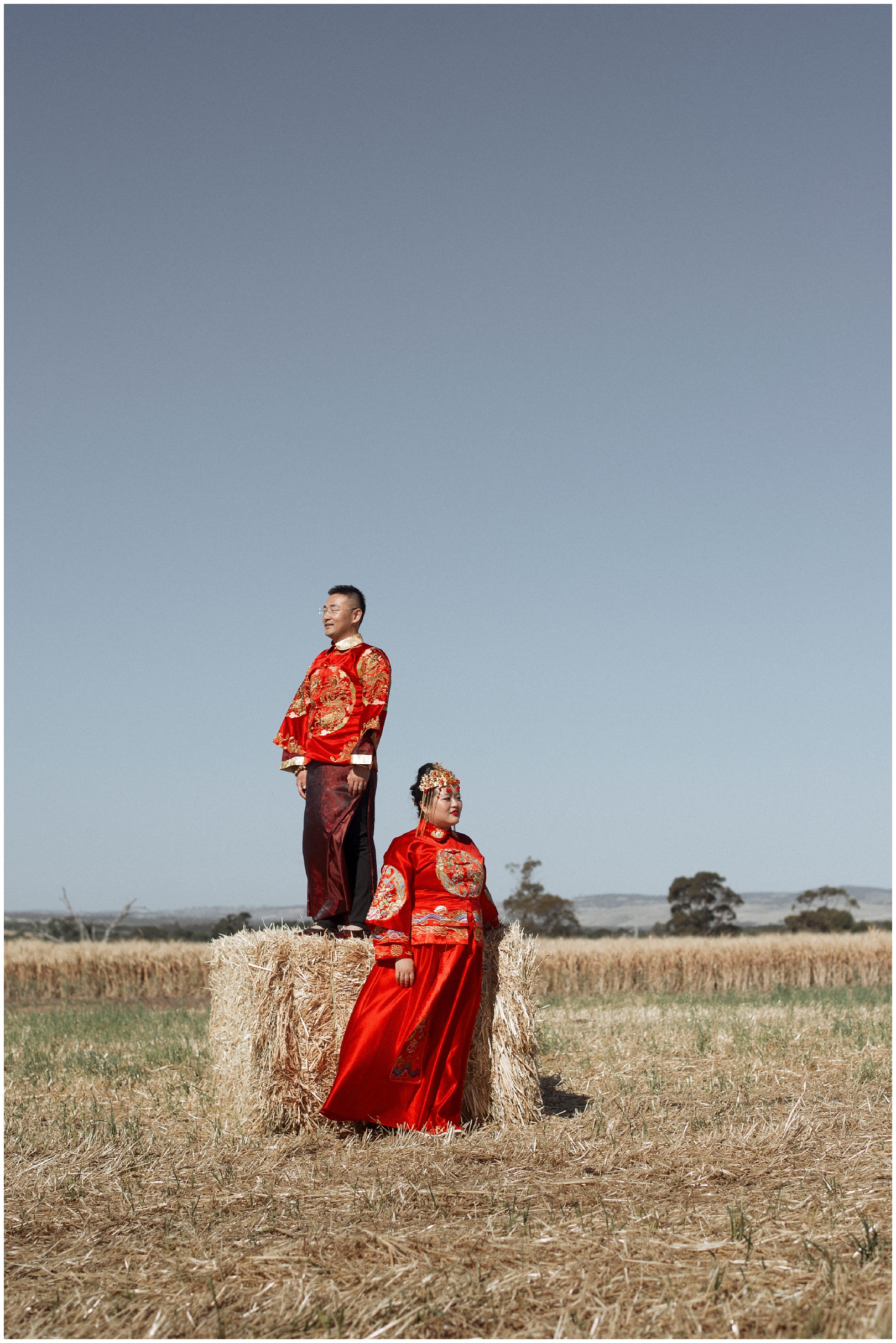 ivy and craig chinese outfits in a field. Wedding celebrations